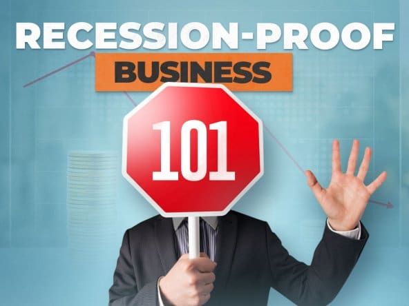 Man in a business suit holding a stop sign up over his face with text that reads "Recession-proof business 101" hovering overhead